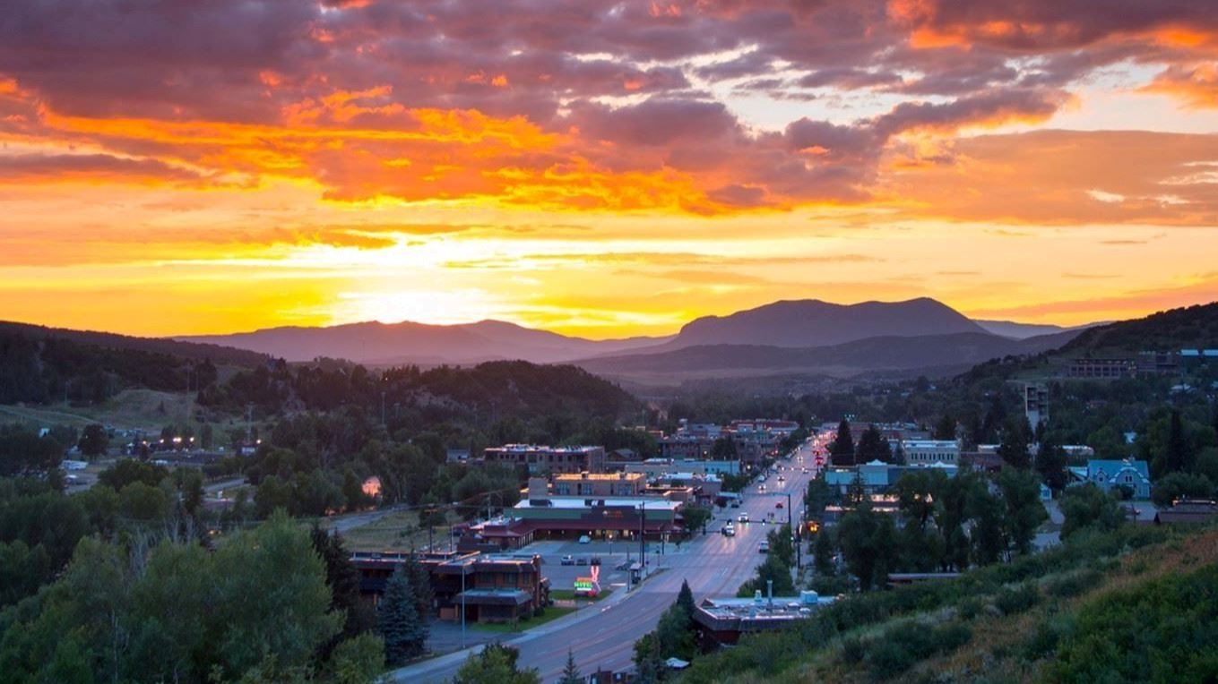 sunset behind mountains from downtown