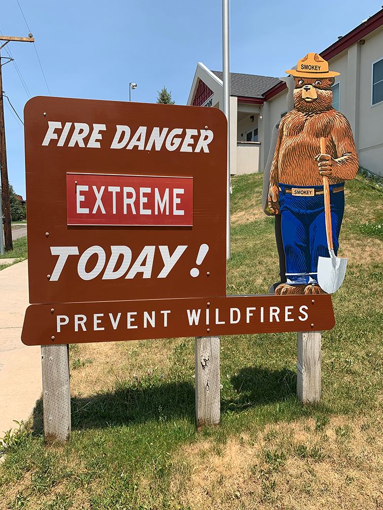 Fire danger sign outside mountain fire station