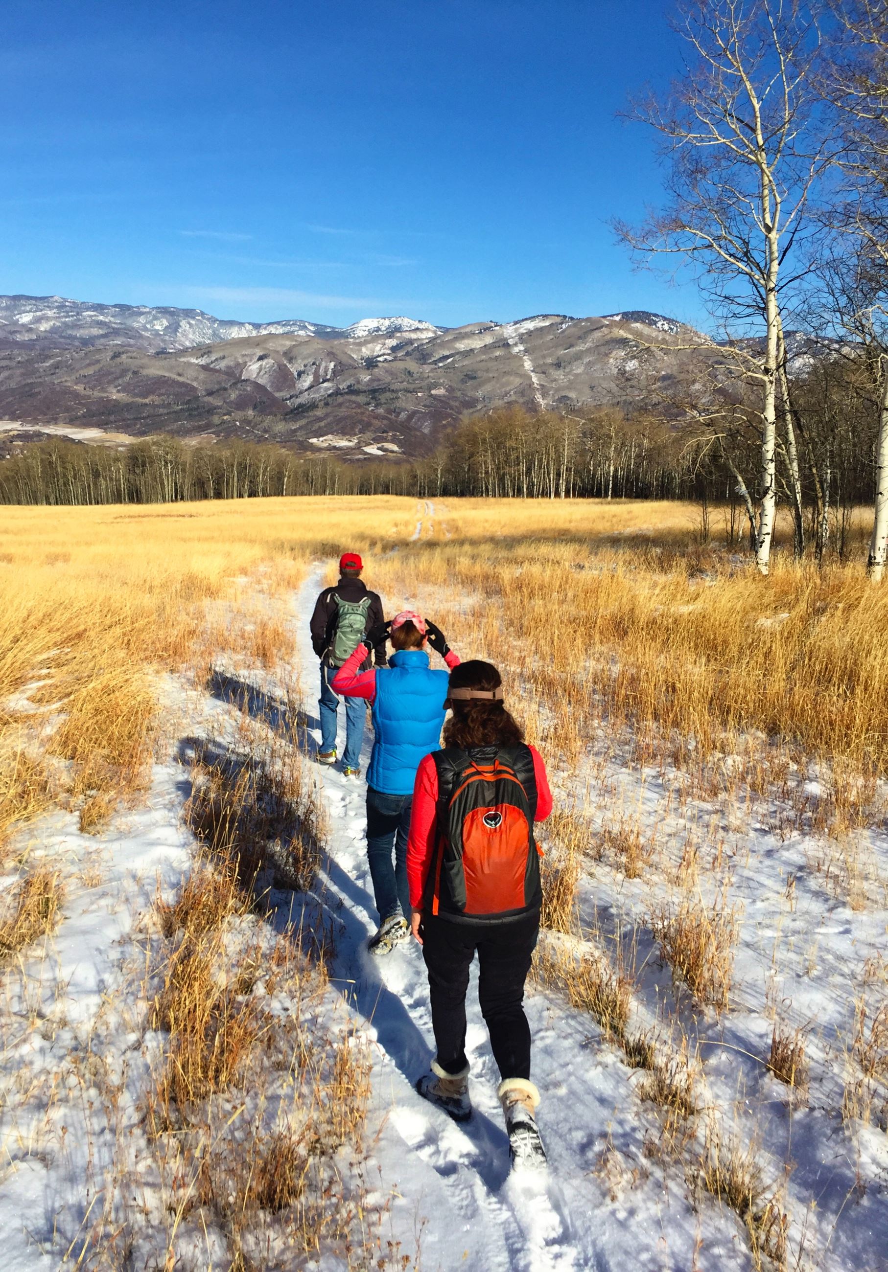 Winter hikers on a trail on Emerald Mountain..